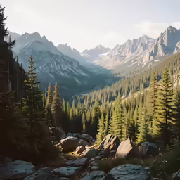 a mountain view with a few large rocks on the bottom