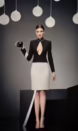 a woman in a white dress with a black jacket