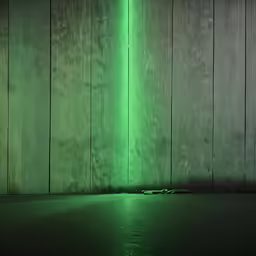 a wall with a light green colored streak in front of it