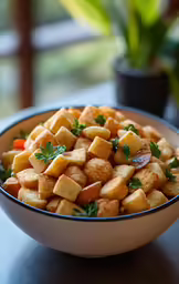 a bowl full of cubes is sitting on the table