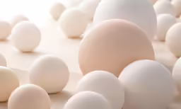 eggs scattered together in an array on a table