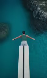 man standing at edge of a pool next to a ramp that looks over the water