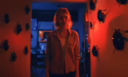 a girl looking at her friend in the hallway