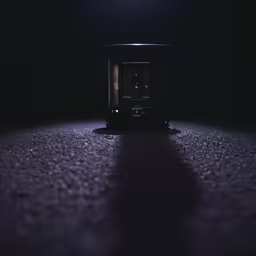 a camera in the dark next to a dark background