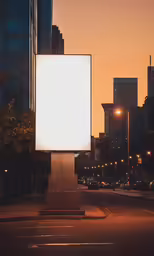 a billboard on the corner at night with buildings in the background