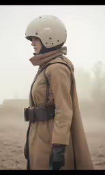 a person in brown jacket with helmet and gloves