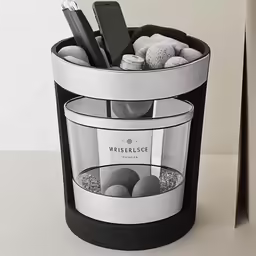 a large metal trash can with some items in it