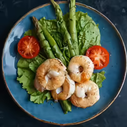 there is an entree that includes asparagus, tomatoes and shrimp