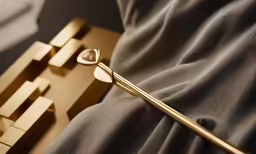 a decorative object with metal parts on the bed