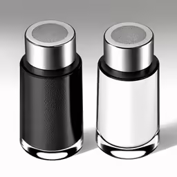 two metal cans with silver trim on top