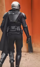 an officer dressed as a man in armor is walking