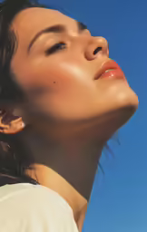 close up portrait of a woman with golden make - up