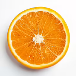 a blood orange sliced into pieces on a white surface