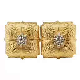 gold tone square studs with flower detail on the backs