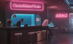 a man and woman sitting at the bar of an asian restaurant