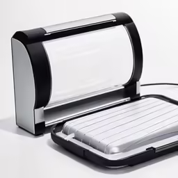 a computer sitting on top of a white counter