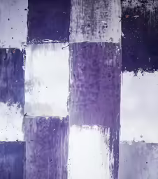 square painting of several colors and some paint drops