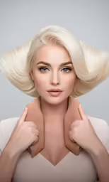 a beautiful blonde woman with long white hair posing for a photo