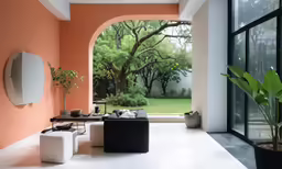 a room with pink walls has a white and black chair