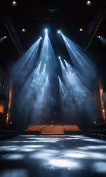 spotlight streaming through an auditorium filled with people