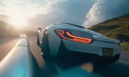 a white sports car traveling down the road