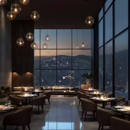 an open concept restaurant overlooking the city lights