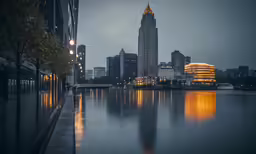 there is a skyline at night with buildings and lights