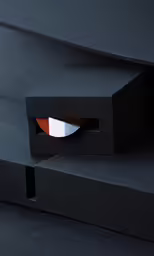 the black surface has a bright orange square hole