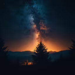 the sky with stars, trees, and a full moon