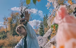 two people with their hands up while holding fruit