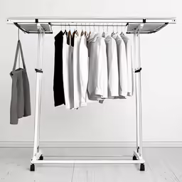 a white coat rack has five shirts hanging