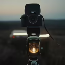 a person is looking through the lens of a camera
