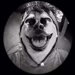 a creepy clown is pictured in this black and white photo