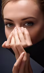 an art photograph of a woman covering her eyes