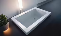 this very sleek bathtub is illuminated by an led