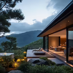 a lounge area overlooking the mountains is lit by candles