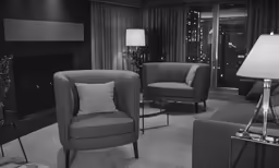 a black and white image of living room furniture