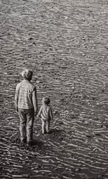 a man and child are walking on a beach