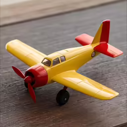 toy plane sitting on top of wooden table