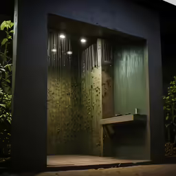 a public restroom with a window covered by rain
