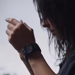 a woman wearing a watch is standing up