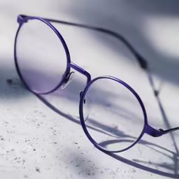 a pair of glasses with purple frames