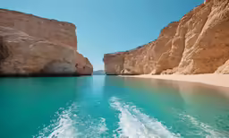 a boat travels through a blue crystal water channel