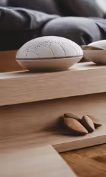 two bowls with two nuts in the middle