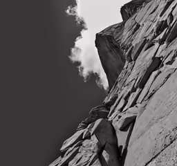 there is some rocks on the side of the mountain