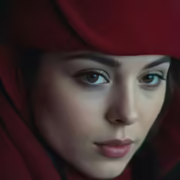 a close - up photo of a woman in a hat and scarf