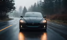 the car is driving in heavy rain on the road