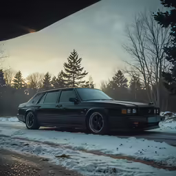 a car parked on the side of the road in the snow