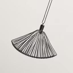 a pendant with a wire hanging from the bottom