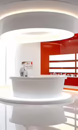 a modern white reception counter sitting in front of a wall